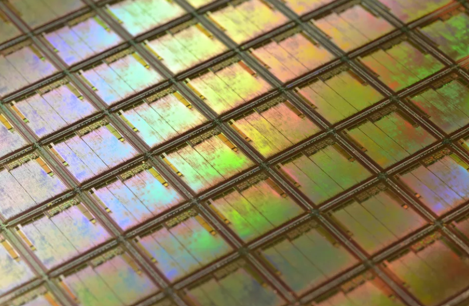 Macro of a silicon wafer. Each square is a chip with microscopic transistors and circuits