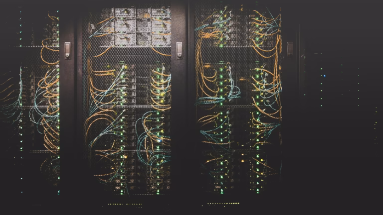 Data center server racks with network cabling, illustrating the OpenAI Nvidia Ohio data center deal