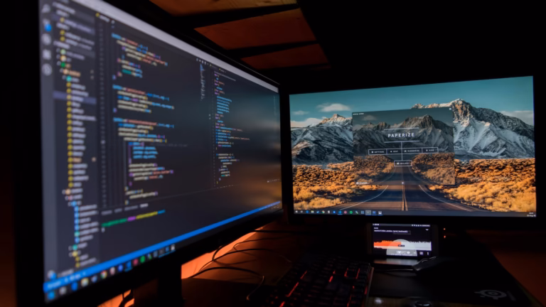 Developer workstation with dual monitors, illustrating GitHub Copilot code review