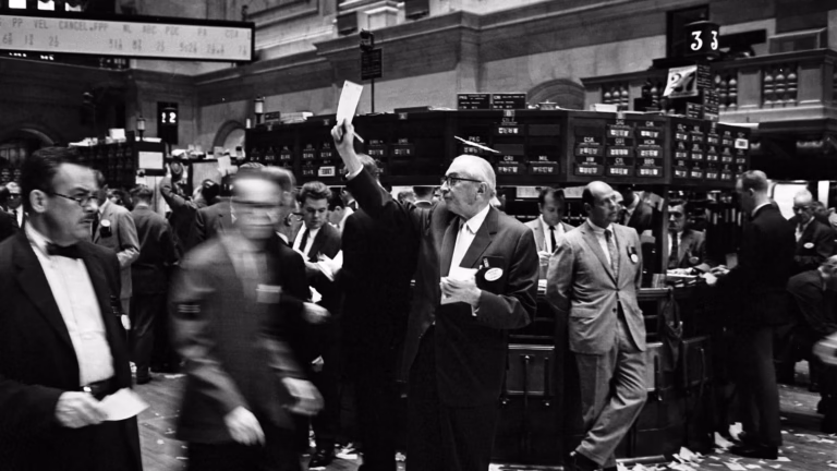 Traders on the floor of the New York Stock Exchange, the job AI trading agents are now doing unsupervised