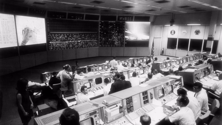 NASA Mission Control during Apollo 11, a closed loop of acting and watching the result