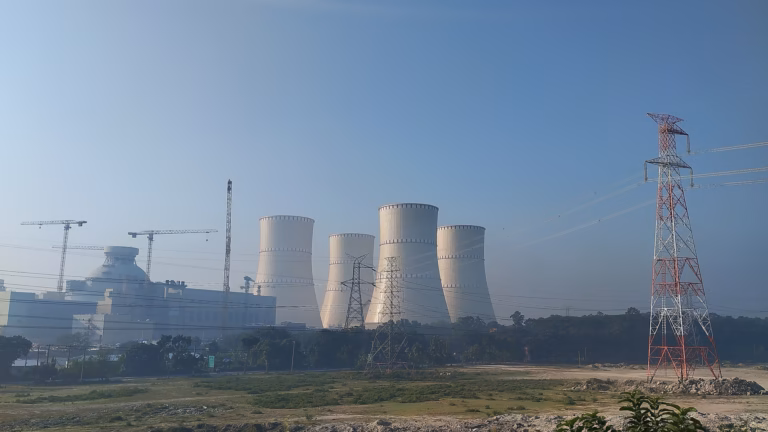 A nuclear power plant cooling tower, the generation data centres are contracting directly rather than queueing for grid capacity
