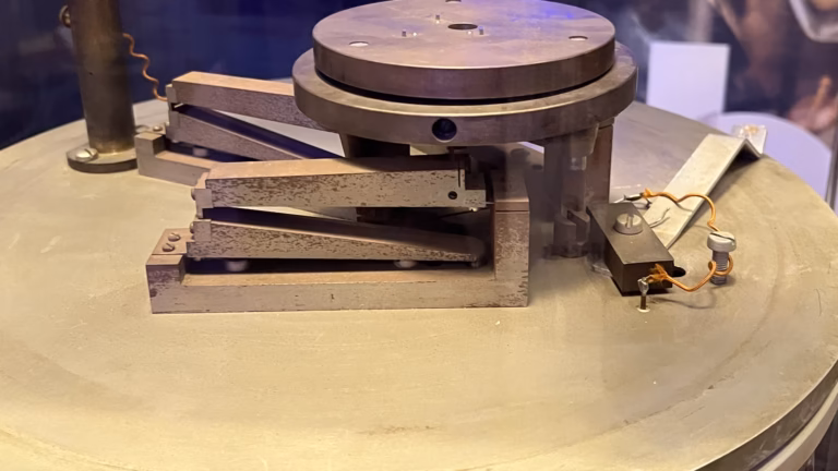 Apparatus from the first measurement of the Casimir force between two parallel metal plates: a metal disc on a spring-arm mount, now in a museum collection