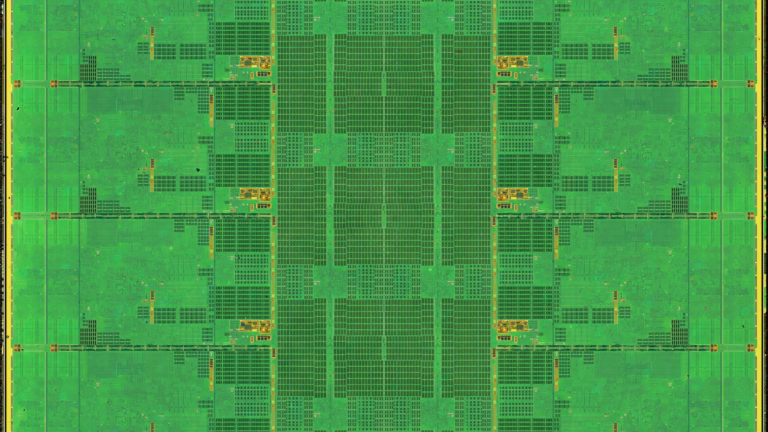 Optical micrograph of an AMD Zen 5 compute die, a 4 nm class FinFET chip, with four cores on each side of the shared cache in the centre