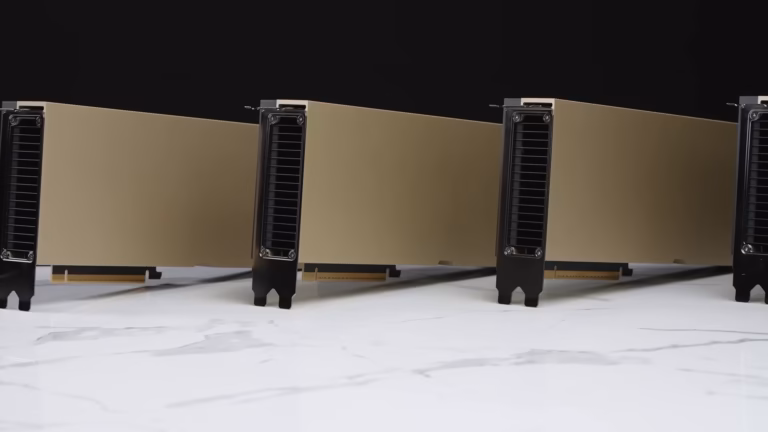 Four NVIDIA H100 PCIe accelerator cards standing in a row on a white marble surface