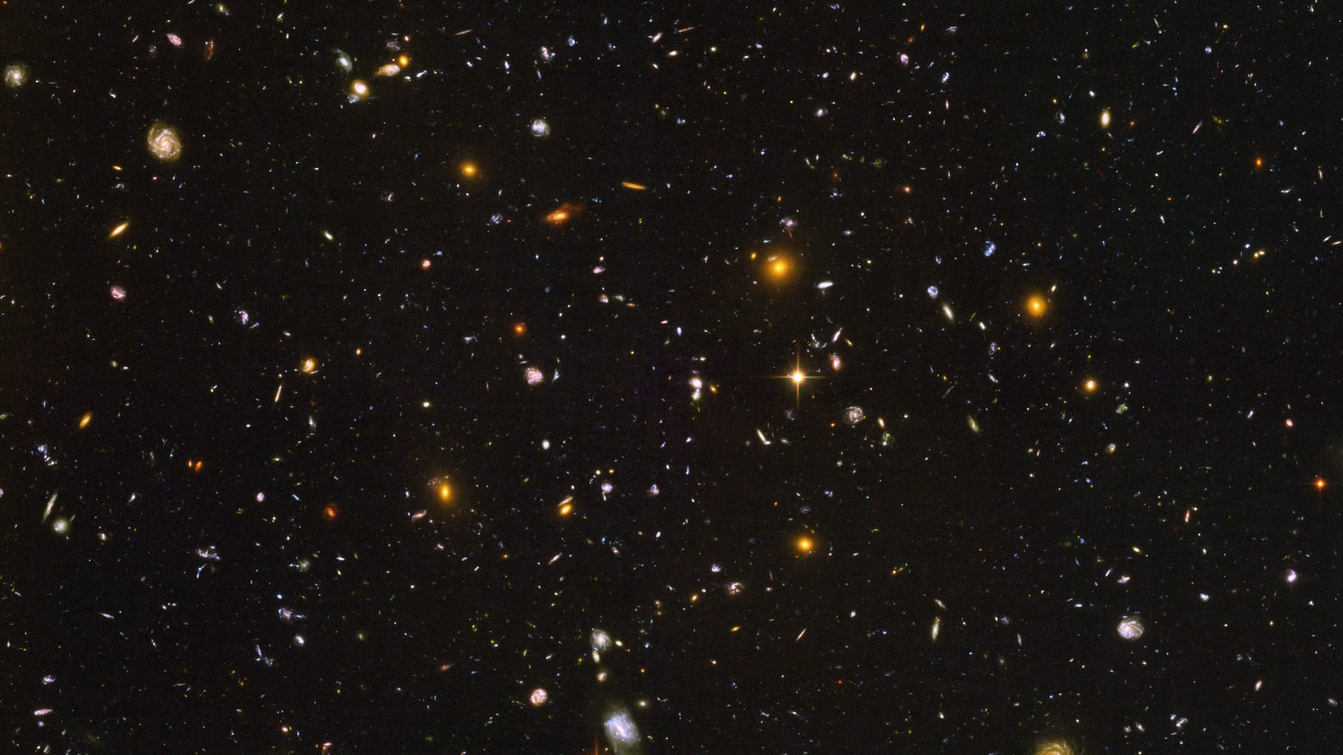 The Hubble Ultra Deep Field: thousands of galaxies of every shape and age in a tiny patch of sky in the constellation Fornax